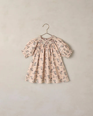 Blush floral smocked dress with puff sleeves on hanger, flat product shot
