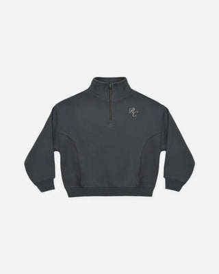 Midnight blue quarter-zip sweatshirt laid flat, featuring a stand collar, zip placket, embroidered 'RC' logo at the chest, curved side seams, and ribbed cuffs and hem.