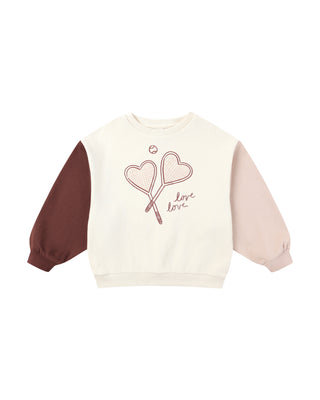 Sweatshirt with heart design and 'love' text on a white background