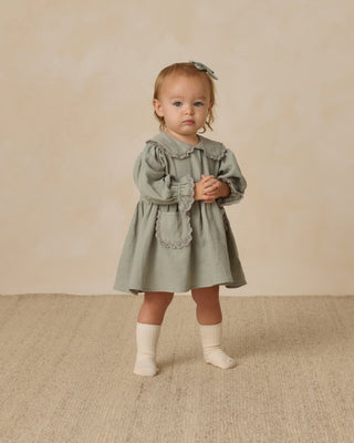 child wearing dress