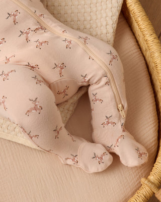 Pink tights with deer pattern in a wicker basket