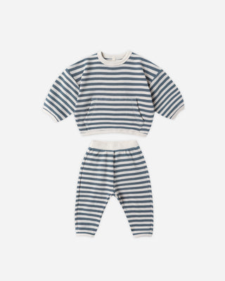 Striped children's outfit with top and pants on a white background