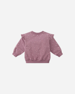 Pink sweatshirt with ruffled sleeves on a white background