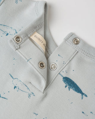 Light blue fabric with whale patterns and Quincy Mae label