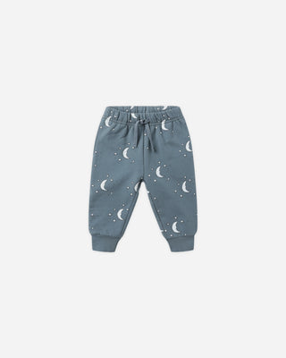 Blue children's pants with moon pattern on a white background