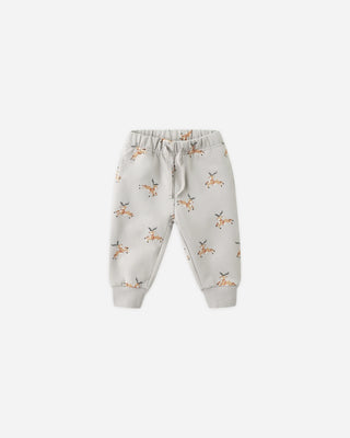 Children's jogger pants with fox pattern on a light gray background