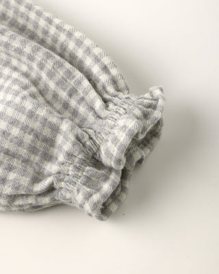 Folded gray checkered fabric on a white background