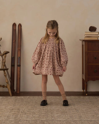Selene Dress in Pink Floral – girl wearing a long puff sleeve floral dress with smocked bodice and lace trim
