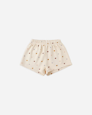 Beige shorts with heart pattern on a white background