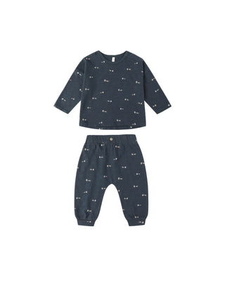 Navy blue children's set with small gold star patterns on a white background