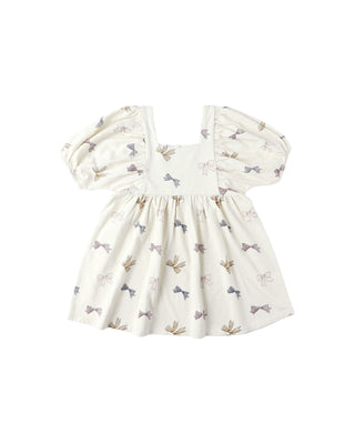 White dress with bow pattern on a white background