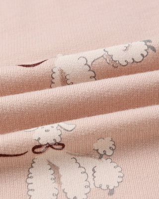 close up of blush dress and poodles