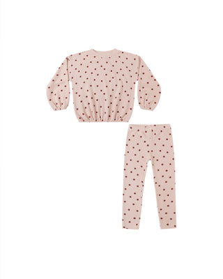 Pink children's outfit with long-sleeve top and pants on a white background
