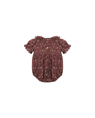 Brown floral baby romper on a white background