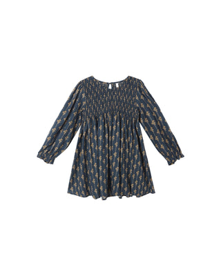 Blue dress with a subtle pattern on a white background