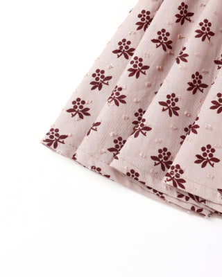 Folded fabric with a floral pattern on a white background