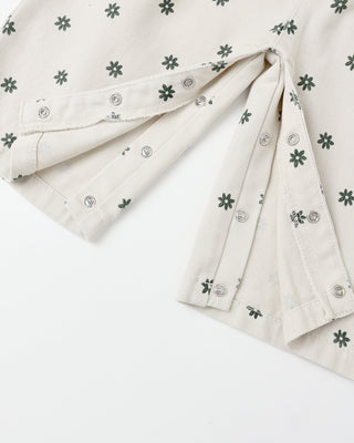 Folded fabric with small floral patterns on a white background