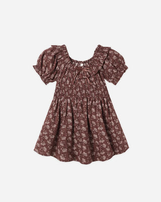 Mulberry floral print dress laid flat, featuring a ruffled square neckline with ribbon tie, puff sleeves, a smocked bodice, and a flared skirt.