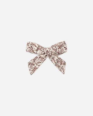 Ivory hair bow with a brown and mauve floral print, shown flat against a white background.