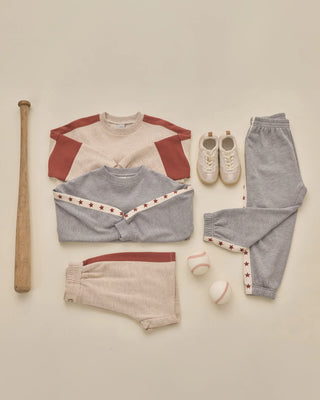 Pouch Pocket Crew in Heathered Dusty Blue – shown with the matching Paneled Sweatpant, Rylee + Cru star trim set