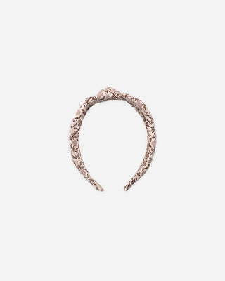 Taupe and brown floral print knotted headband shown flat against a white background.