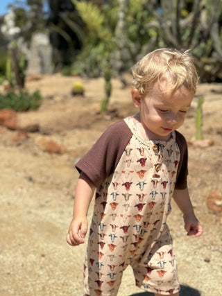 Flinn Baby Henley Romper – Ultra - Soft Cotton Cow Print - Lindsey Paige